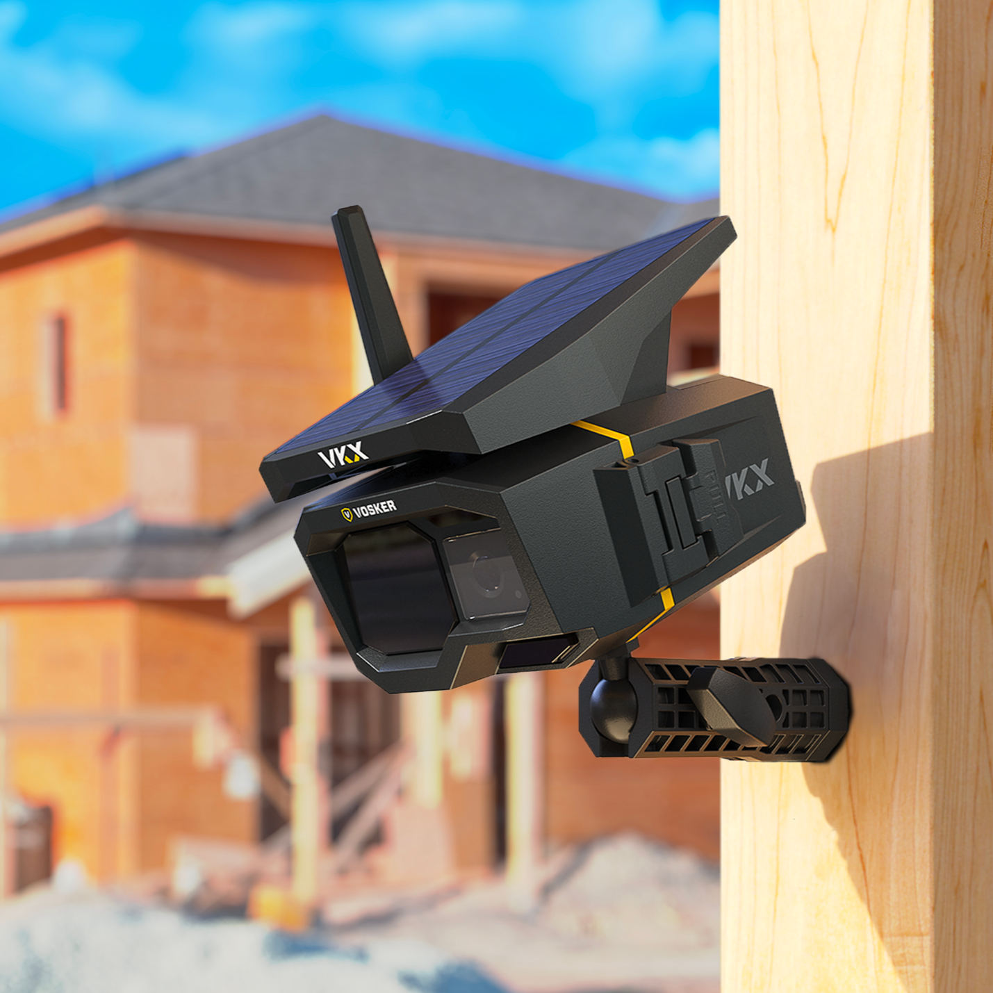 Vosker VKX LTE Solar Cellular Camera mounted on a wooden post at a construction site, with solar panel facing upward and antenna extended.