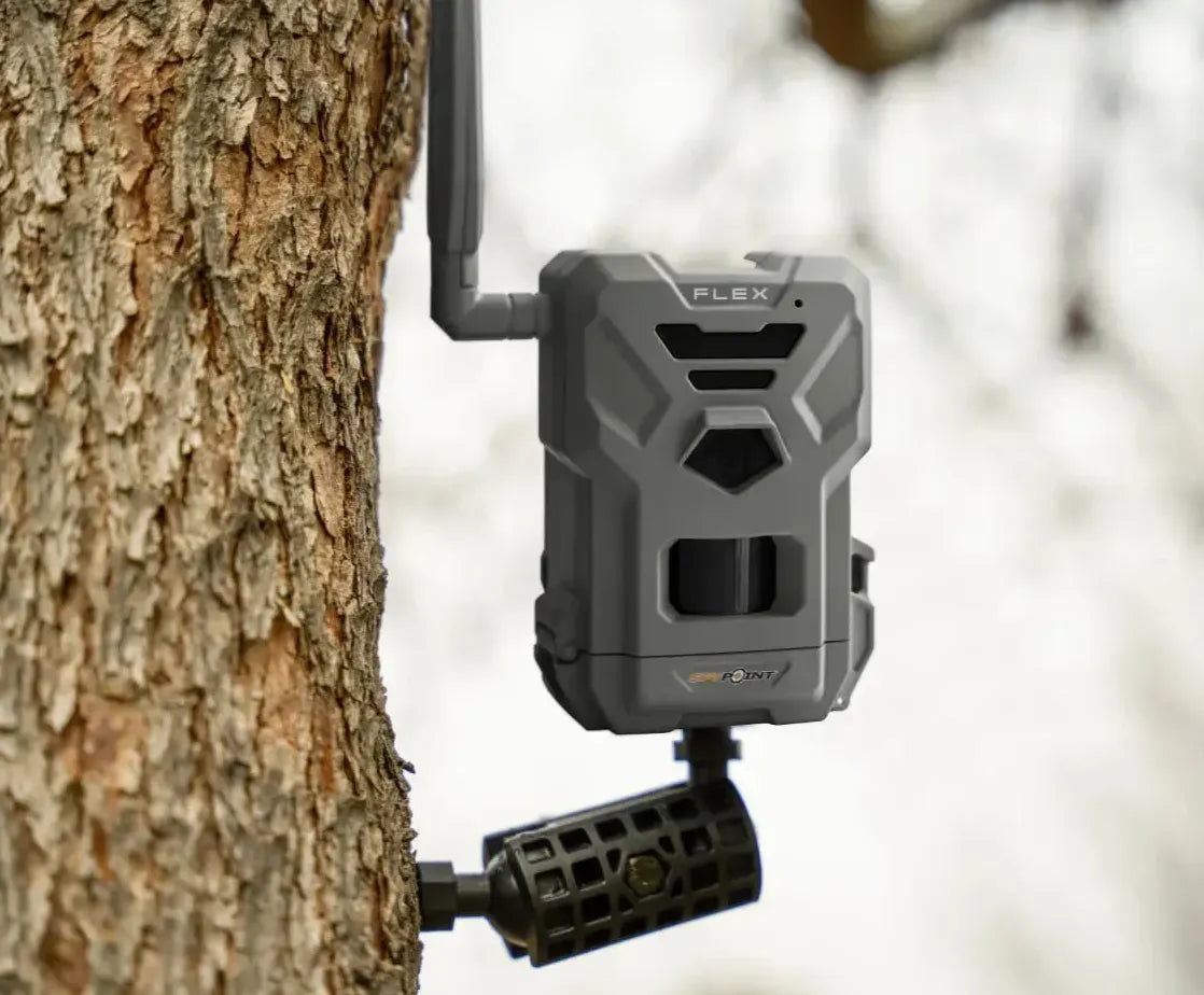 SPYPOINT MA-500 Mounting Arm installed on a tree, securely holding a trail camera in outdoor conditions